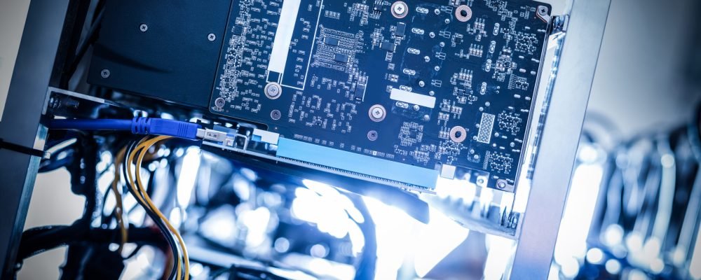 Fragment of cryptocurrency miner in a close-up shot. Bitcoin mining farm. IT hardware